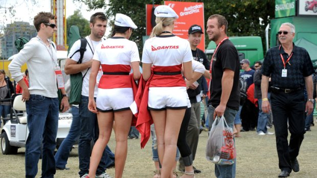 Grid girls with fans at the Australian Formula One Grand Prix at Albert Park.