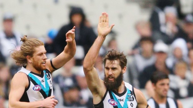 Justin Westhoff and Aaron Young celebrate a goal.