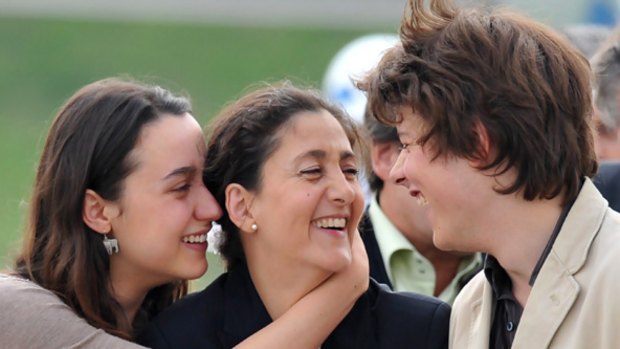 Back together: Freed Colombian hostage Ingrid Betancourt is reunited with her children Melanie and Lorenzo at a Bogota airport after six years in captivity.