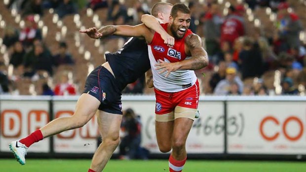 Lance Franklin injures his knee in a marking contest.