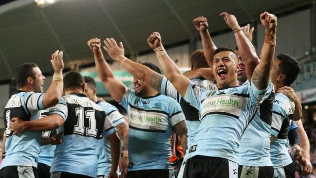 Welcome relief: Ecstatic Sharks players celebrate a victory for the ages.