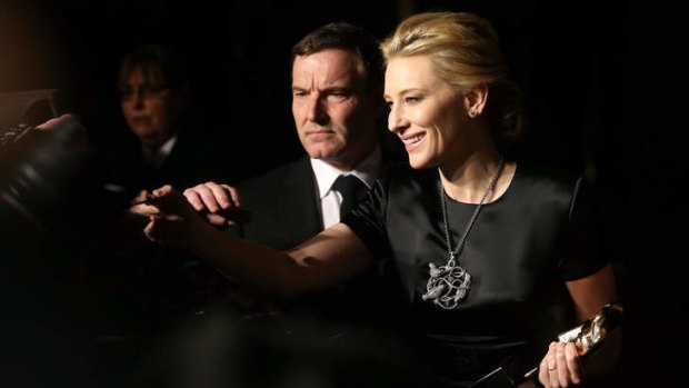 <i>Blue Jasmine</i> actress Cate Blanchett signs autographs as she attends an official dinner party after the British Academy Film Awards at The Grosvenor House Hotel in London.