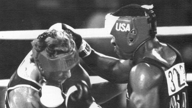 New Zealand's Kevin Barry ducks a punch from Evander Holyfield in Los Angeles in 1984.