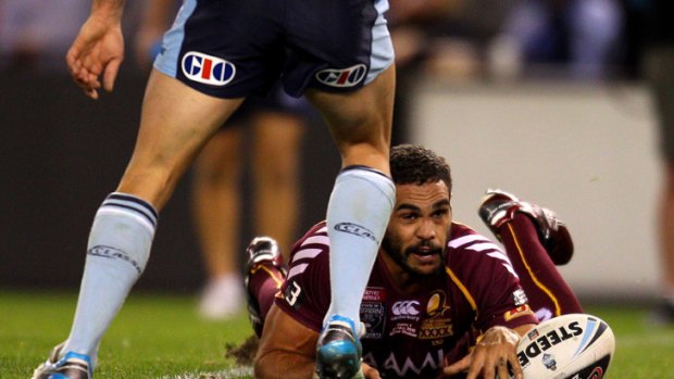 Greg Inglis looks up after scoring the controversial try in last night's State of Origin clash.