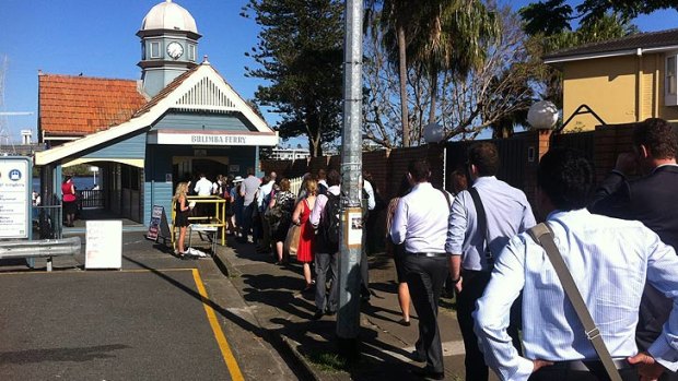 Commuters queue to board the CityCat service in Bulimba on Tuesday morning.
