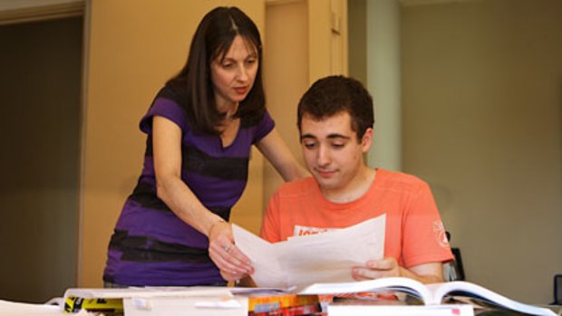 Spends up to eight hours studying a day ... George Lazaris, who begins HSC exams this week, with his mother, Christine.