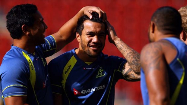 Heads up &#8230; Cooper Vuna gets to grips with fellow winger Digby Ioane at training yesterday.