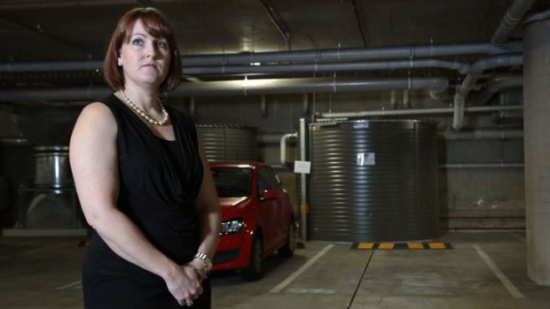 Olivia Hutchinson owner of Diamond Boutique with the parking spot she bought for her customers in the Mode 3 development in Braddon.