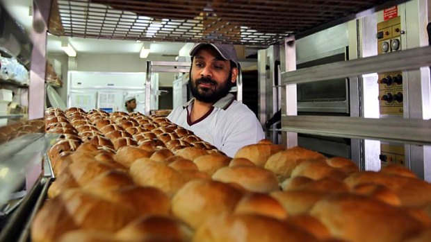 Rising demand... manager of Bakers Delight in Glebe, Ravinder Singh, says he would like to employ several more bakers for his store.