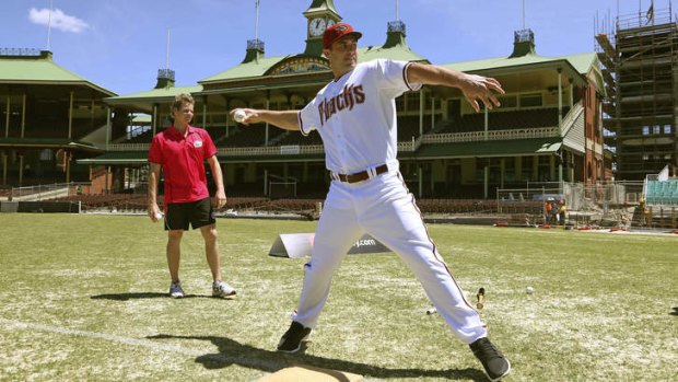 Paul Goldschmidt throws a ball as Steve Smith watches on at the SCG on Monday.