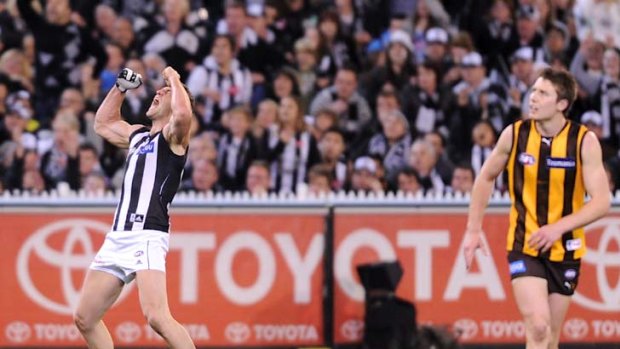 Mighty happy Magpie ...  Collingwood forward Travis Cloke celebrates after kicking a goal for the Magpies in their preliminary final victory over Hawthorn at the MCG last night.