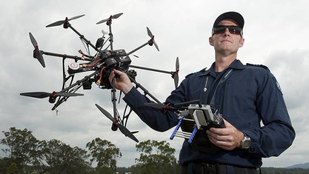 Sergeant Shawn Tansley with the police service's Remote Piloted Aircraft at Wacol.