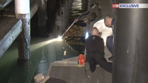 Police search for a missing man at Darling Harbour.