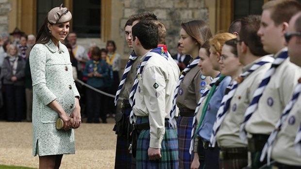 Catherine, Duchess of Cambridge, whose first child is due is July, meets scouts as she attends the National Review of Queen's Scouts at Windsor Castle.