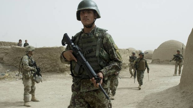 Soldiers from the Afghanistan National Army (ANA) and US Army soldiers from the 3rd platoon Delta company conduct a joint patrol  at Nevay-deh village in Kandahar province on September 5, 2012.