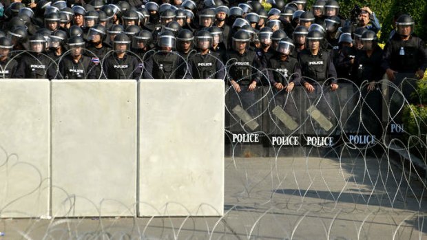 Preparing for the worst: Thai riot policemen stand in formation.