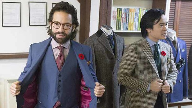 Michael Lavigne, left, wears a bulletproof vest made by made by Garrison Bespoke tailors, beside co-owner Michael Nguyen.