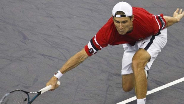 Courting success: Matthew Ebden stretches for the ball during his clash with Andy Murray in Shanghai.