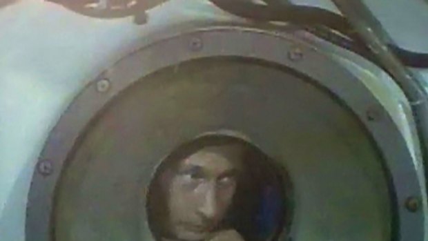 Taking a dive ... Vladimir Putin inside a Mir-1 mini-sub during a journey to the bottom of Lake Baikal.