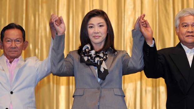 Yingluck Shinawatra, centre, is set to become Thailand's first female prime minister.