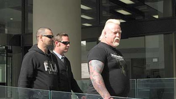 Bradley Neil Trappitt (middle) and his two burly minders in front of the Perth Magistrates Court. <i>Photo: Aja Styles</i>
