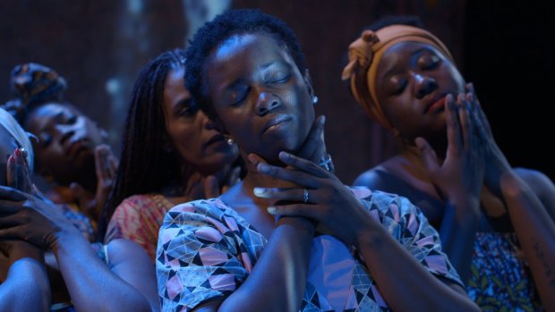 Aminata Conteh-Biger (centre) in the play, which focuses on the lives of a group of African refugees and their struggles with sexual and physical violence before arriving in Sydney.
