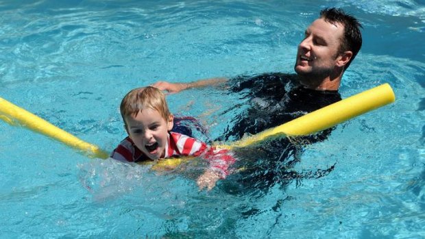 Canberra golfer Brendan Jones  plays with his son  Kieran,  3,  in the pool at home in Campbell .  He is back from a year on the Japanese Tour.