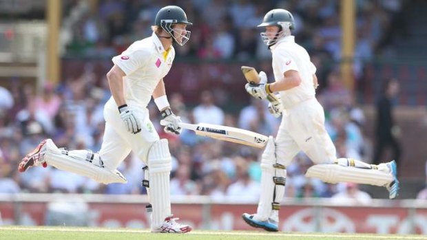 Nice day for a run: Shane Watson and Chris Rogers run between the wickets on Saturday.