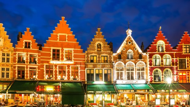 Night image of north side of Market Square, with enchanting street cafes, meeting place of the Bruge.