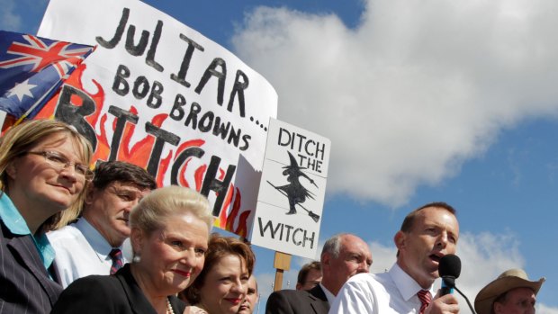 Tony Abbott and those infamous signs, outside Parliament House in 2011.