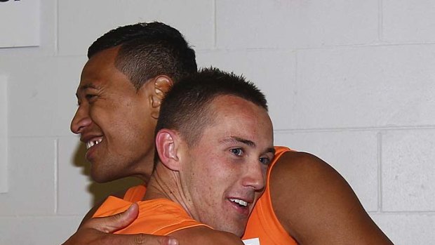 Tom Scully with fellow Giant Israel Folau, who left rugby league for AFL.