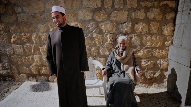 Sheikh Mosaad Negm and his father outside the mosque in Hasbaya.