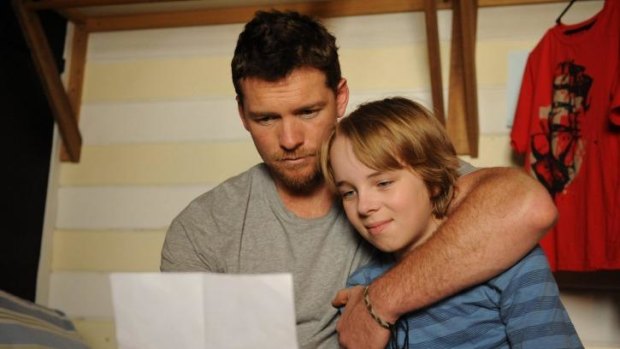 Sam Worthington and Ed Oxenbould  in <i>Paper Planes</i>.