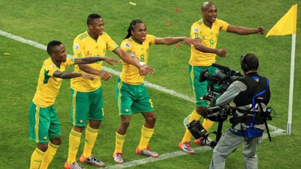 First gopal ... Siphiwe Tshabalala, centre right, celebrates with his teammates.