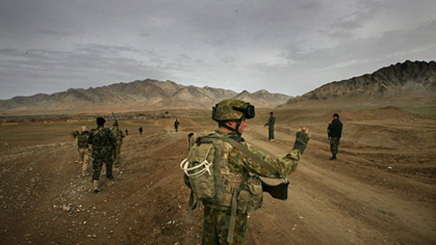 Australian soldiers on patrol in Afghanistan. The Australian Federal Police is sending members to train Afghans.