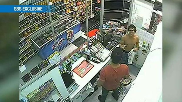 A still taken from security cameras inside a convenience store show a man resembling Roberto Laudisio Curti shortly before his death.