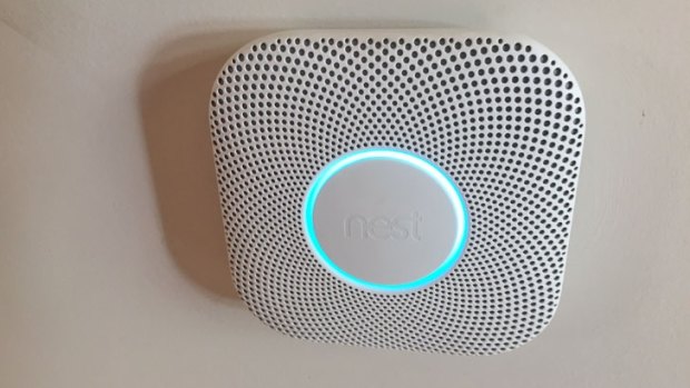 The large Nest button lets you silence the alarm, while the glowing ring acts as a status indicator.