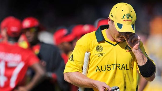 Australian batsman Brad Haddin walks off the ground after being dismissed for 29 from 66 balls.