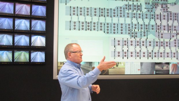 Ray Wilson, Brisconnections’ chief executive officer, briefs the media in the Airport Link control room.