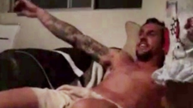 Damning: A still from the video showing a seemingly intoxicated Mitchell Pearce slumped on a chair.
