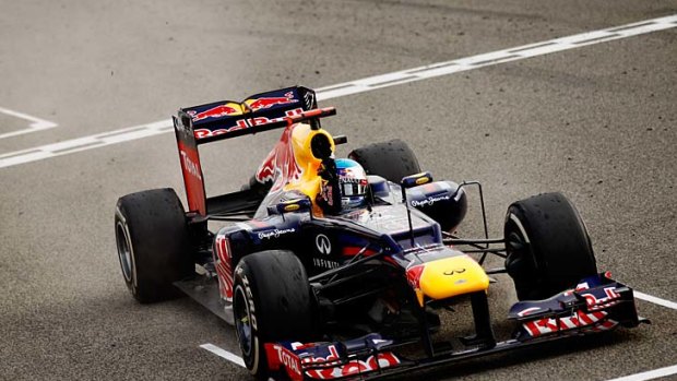 Sebastian Vettel of crosses the finish line to win the Bahrain Grand Prix.
