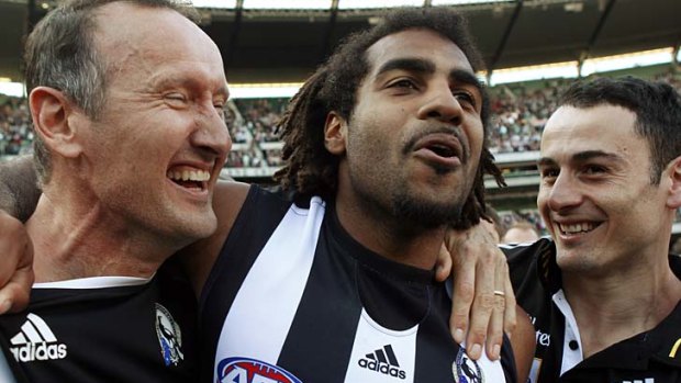 It has taken Magpies fitness coach David Buttifant, seen here with defender Harry O'Brien and assistant Paul Licuria after the 2010 premiership win, two years to convince the club that the mid-season trip is worthwhile.