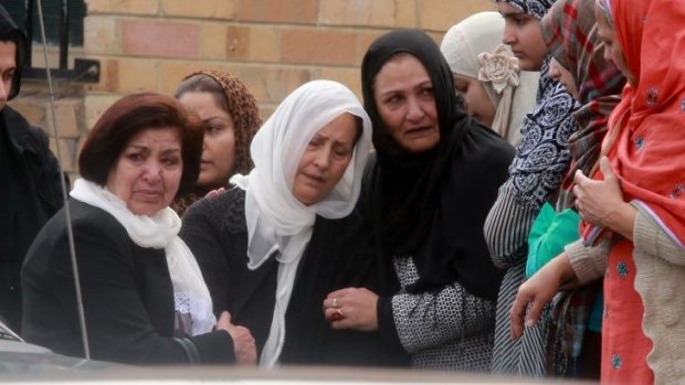 Relatives and friends at Numan Haider's funeral.