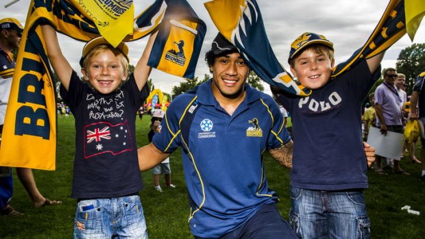 The Brumbies' Joe Tomane with new fans Max Gildea(6) and Conor Gildea (10) from Hughes.