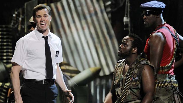 Actor Andrew Rannells (L) performs a scene from The Book of Mormon.
