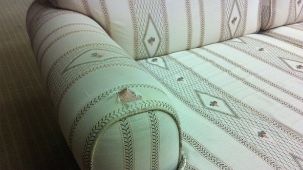 One of the damaged sofas in the Premier's office.