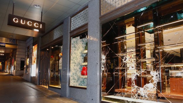 Sledgehammers were used to smash into the Gucci handbags store on Collins Street. 