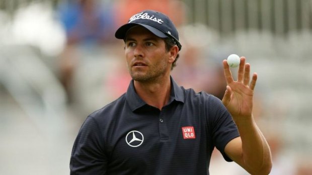 Adam Scott reacts afer for birdie on the 18th green.