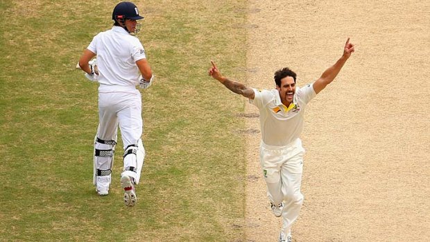 Mitchell Johnson of Australia celebrates after taking the wicket of Alastair Cook in the second innings of the Second Test.