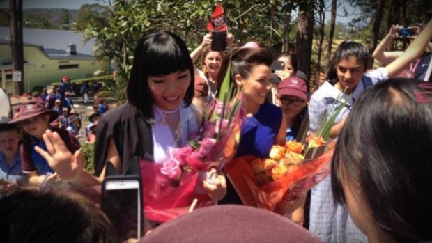 Dami Im and Dannii Minogue arrive together at Ms Im's old school John Paul College last year.